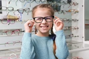 young girl with glasses
